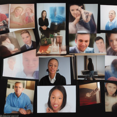 A collection of black and white photographs featuring people with glasses, some of which include a man sitting at a desk and a woman with braces in her teeth. There is also a picture of a person holding a book.