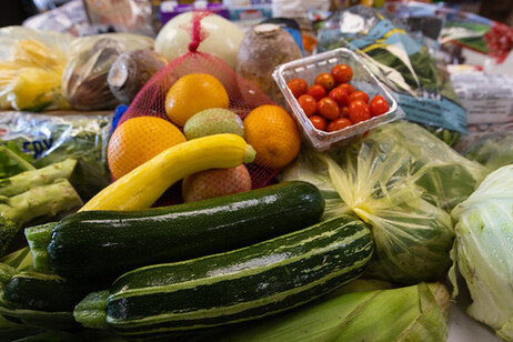 A table full of various fruits and vegetables.